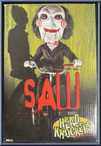 Billy the Puppet (Tricycle) from Saw - Head Knockers manufactured by Neca [Front]
