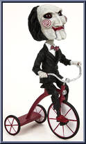Billy the Puppet (Tricycle) from Saw - Head Knockers manufactured by Neca [Loose]